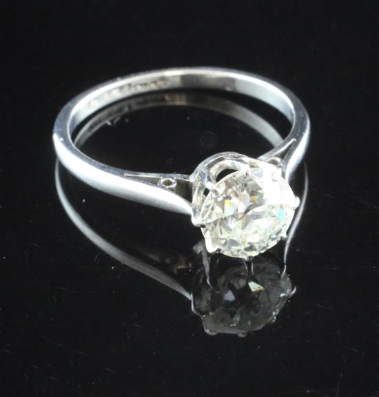 A platinum and solitaire diamond ring, size N.